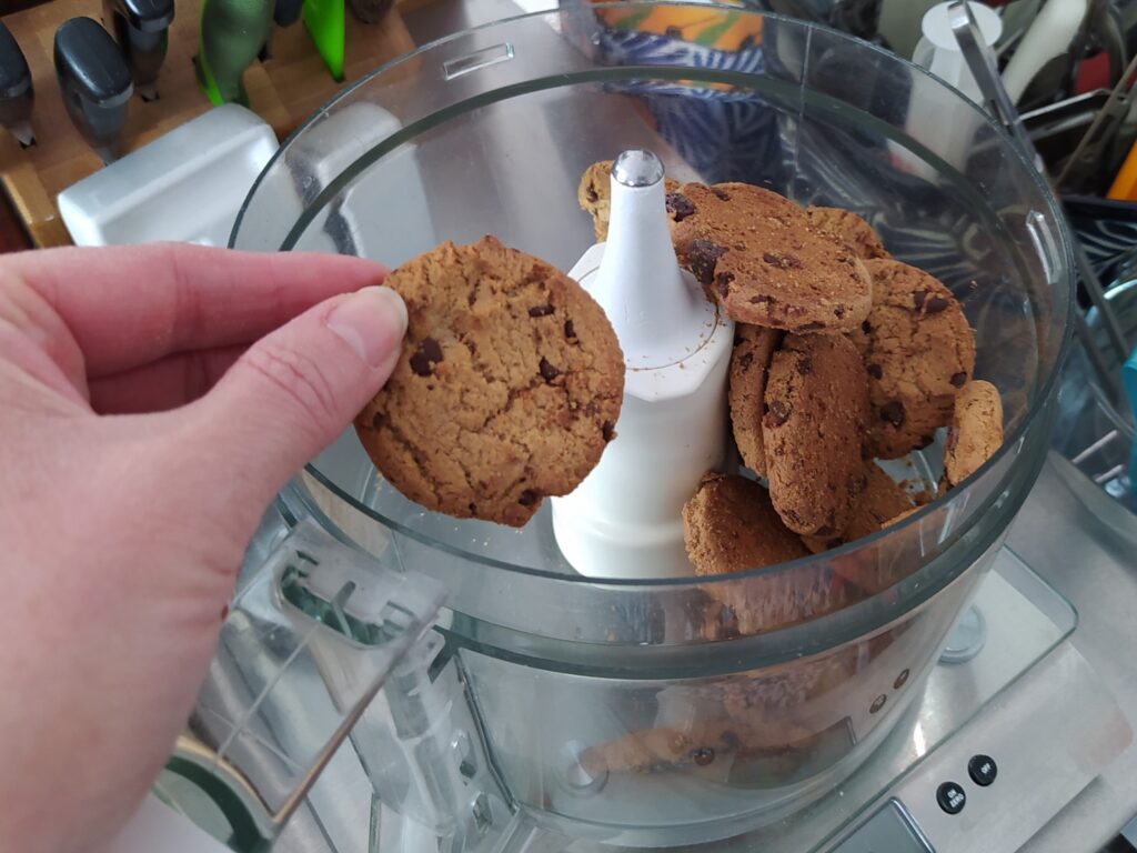 Grinding chocolate chip cookies for a cheesecake crust