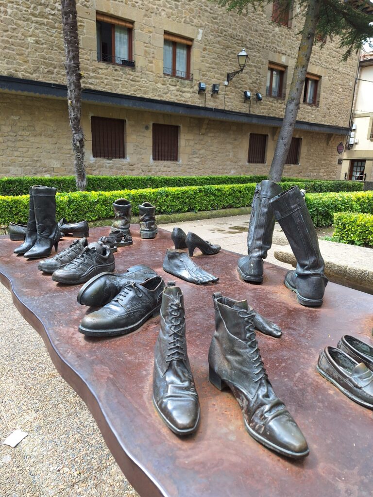 Bronze sculptures of shoes and luggage in Laguardia, Spain